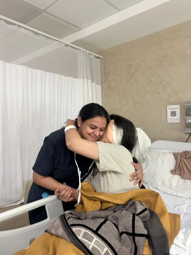 A patient hugs Dr. Trisha Srivastava after surgery
