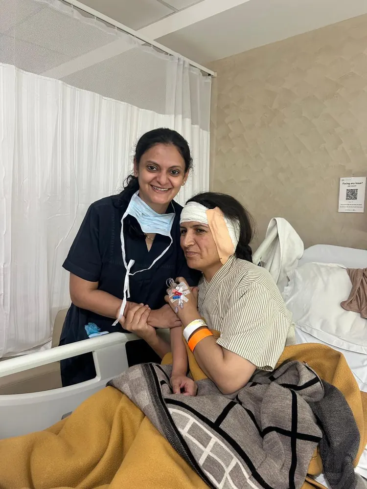 Dr. Trisha Srivastava with a patient recovering after ear surgery